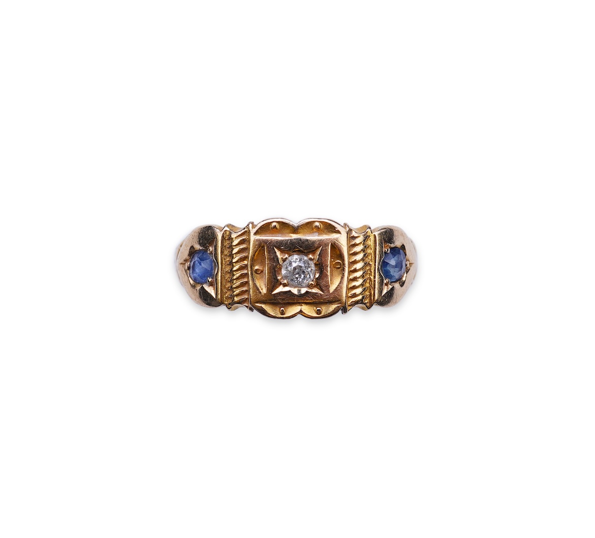 A Victorian sapphire and diamond three-stone ring, circa 1892
